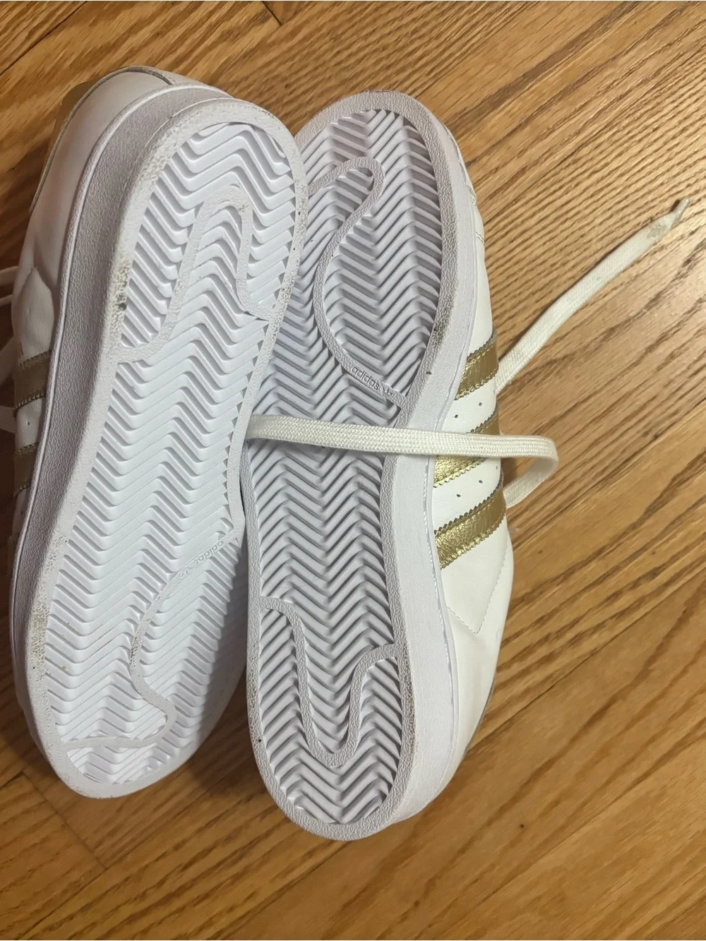 adidas Women's White Sneakers with Gold Stripe Accents